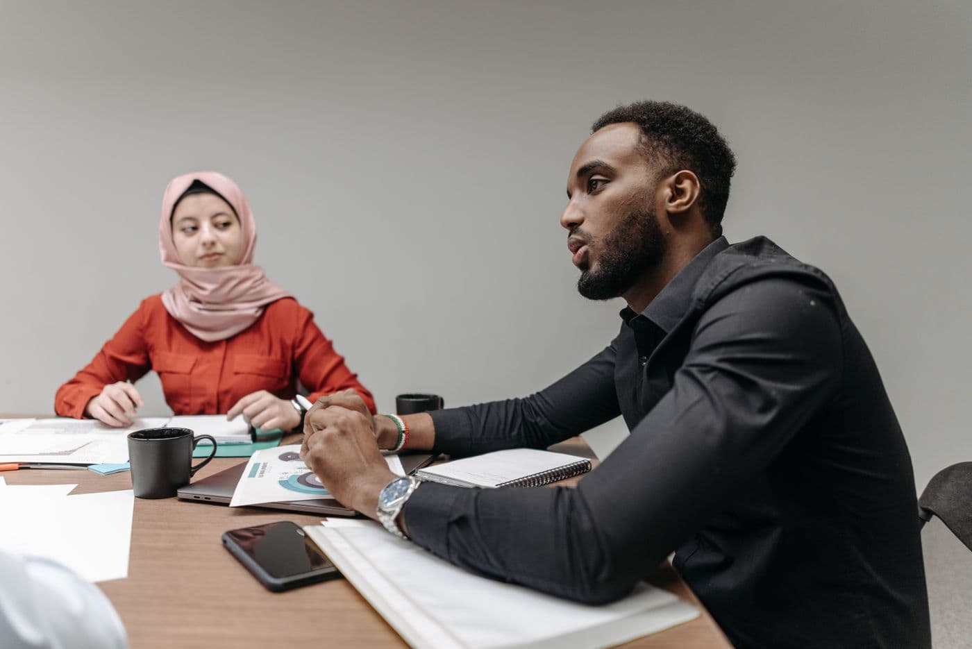 Colleagues collaborating in a bright shared workspace