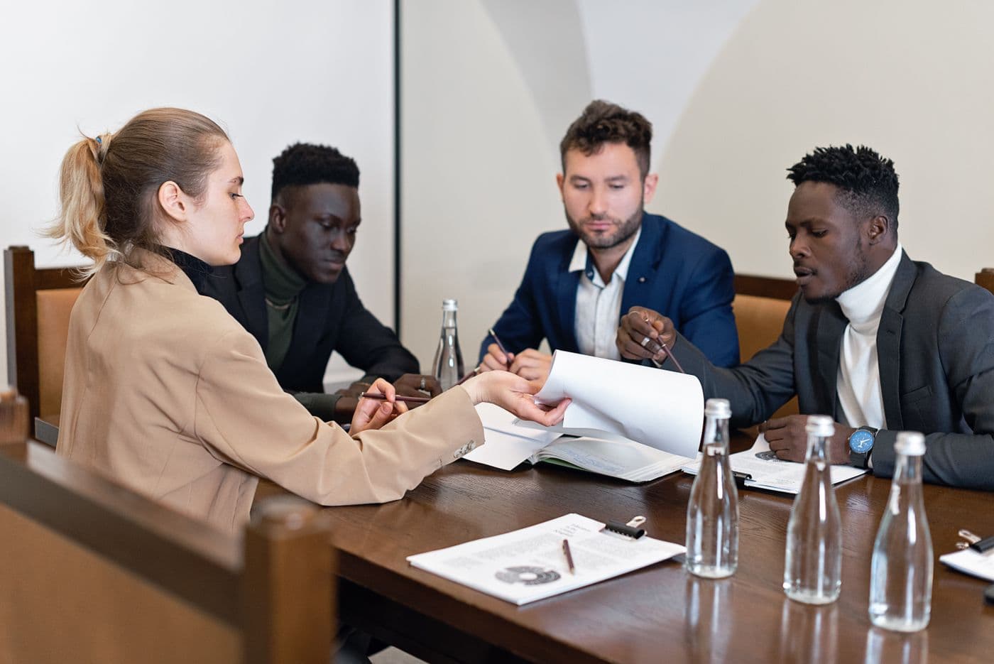 Business team reviewing documents together at a conference table