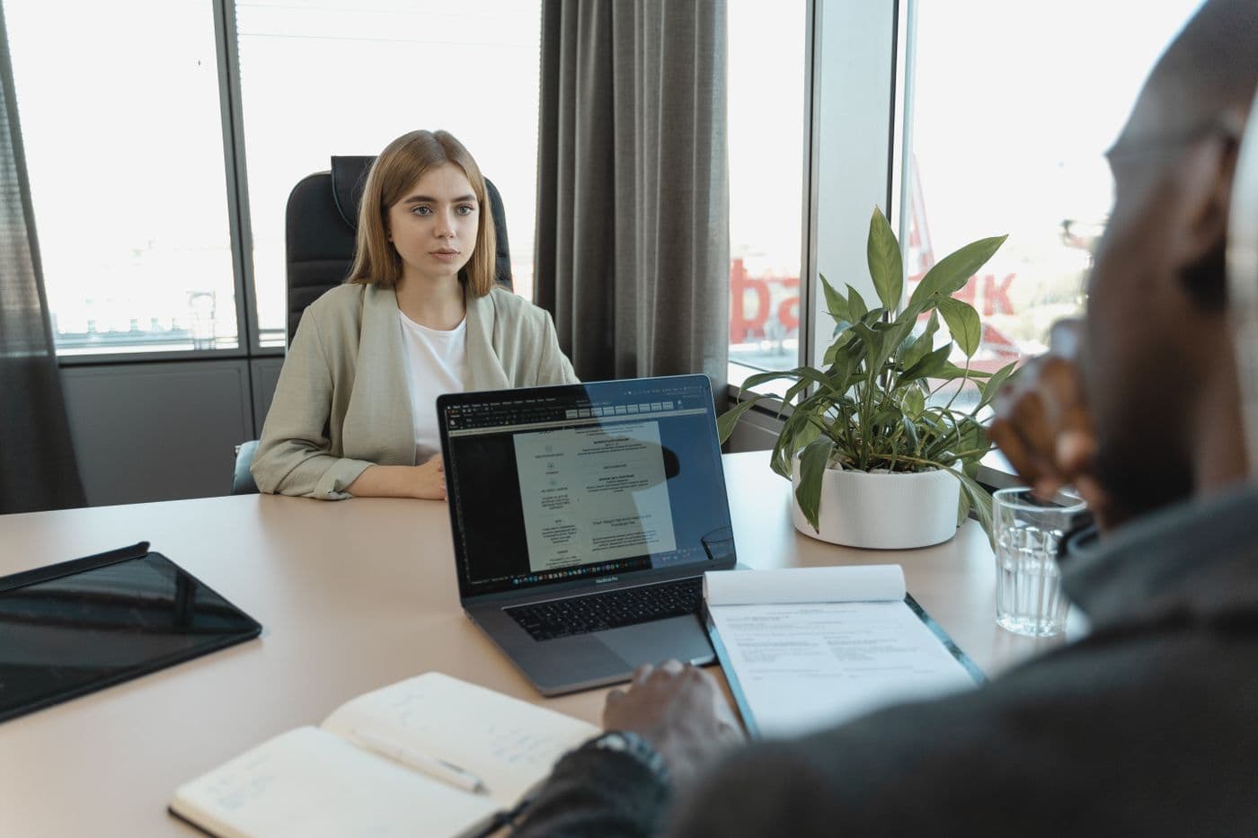 Candidate and interviewer speaking across a table