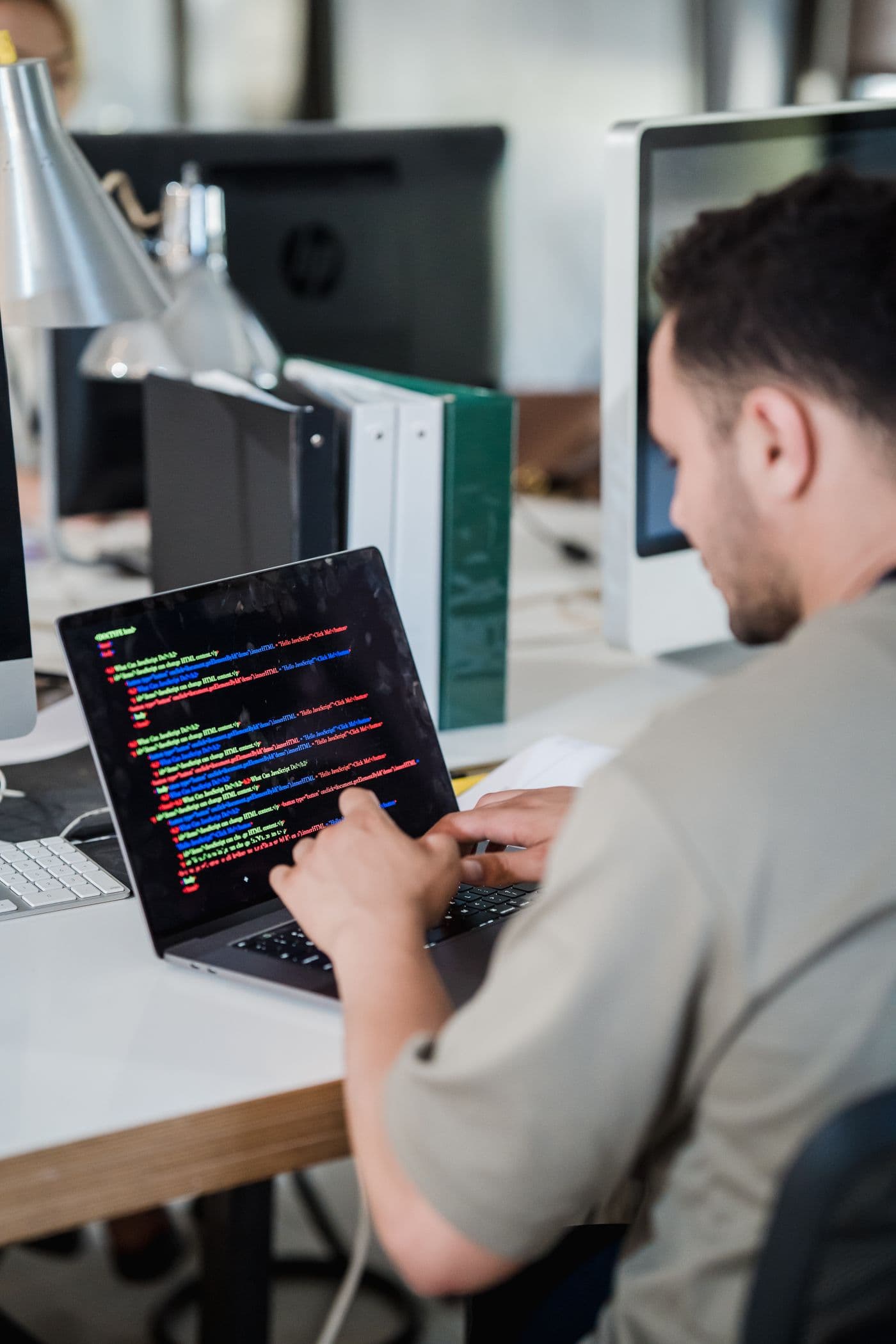 Technology professional working at a computer workstation